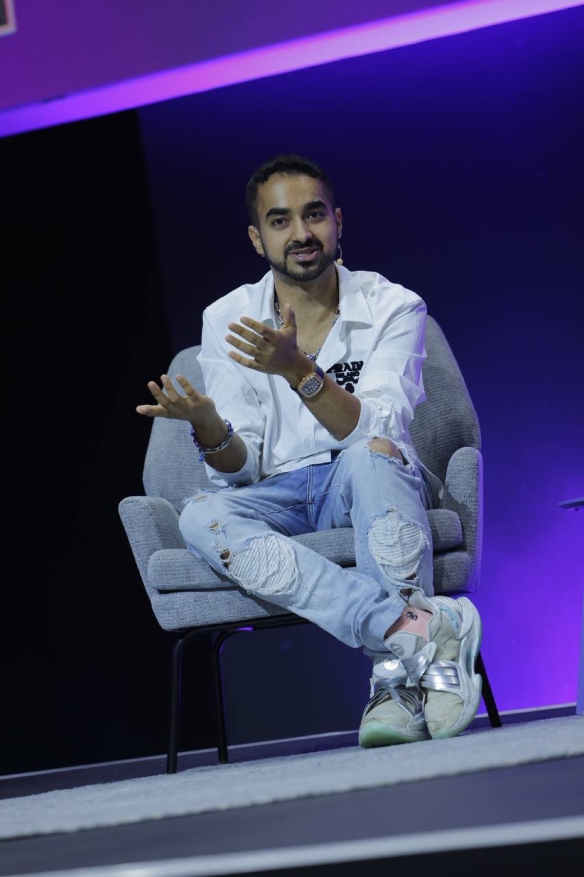 Evan Luthra speaking on stage